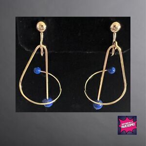 Spiral Motion Clip Goldtone Earrings with Lapis Blue Accents - Avon 1991 - NIB